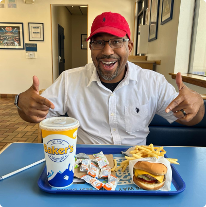 A bakers customer enjoying a bakers drive thru meal