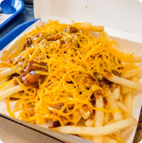 A plate of bakers drive thru fries covered in cheese and meat