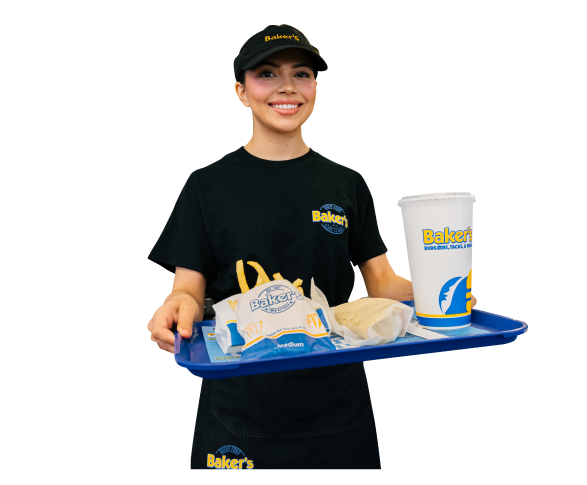 A lady smiling wearing a bakers drive thru uniform in black and holding a tray of supersized drink, chips and a burrito